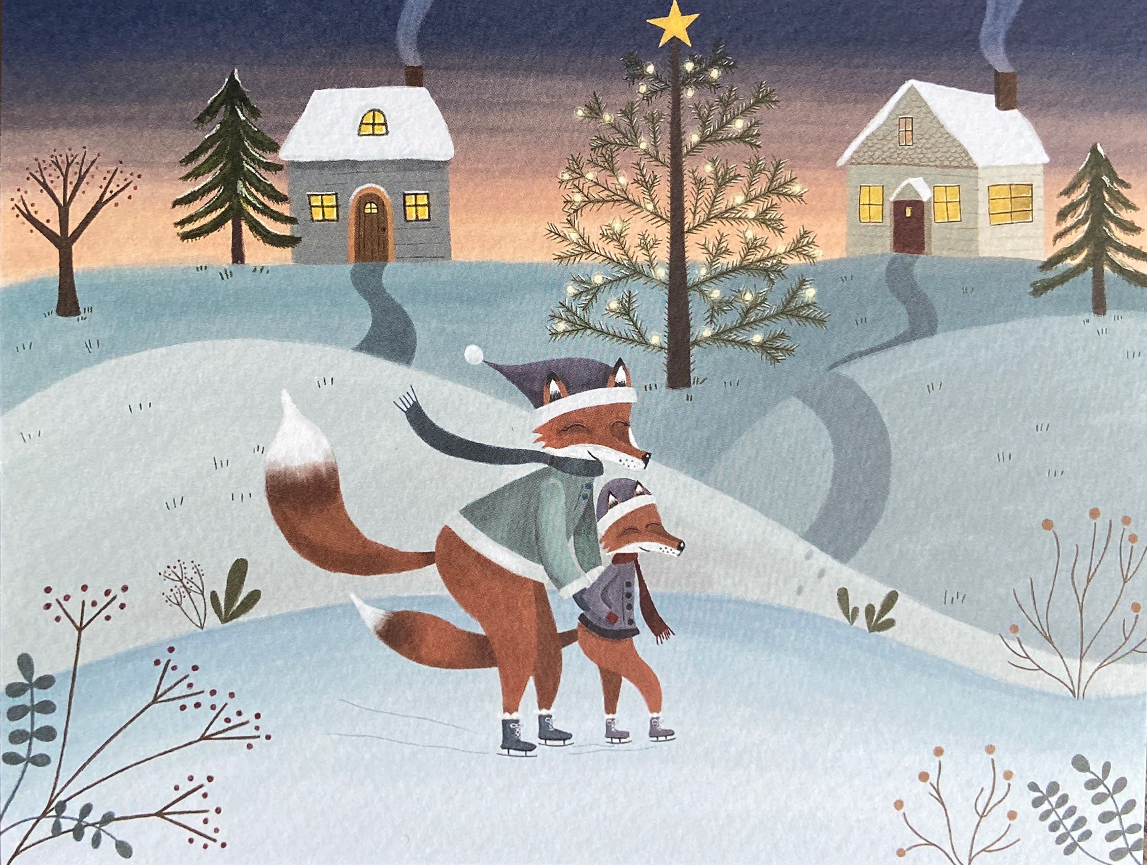 Greeting card illustration of two foxes skating on a snowy landscape with a starry night sky.