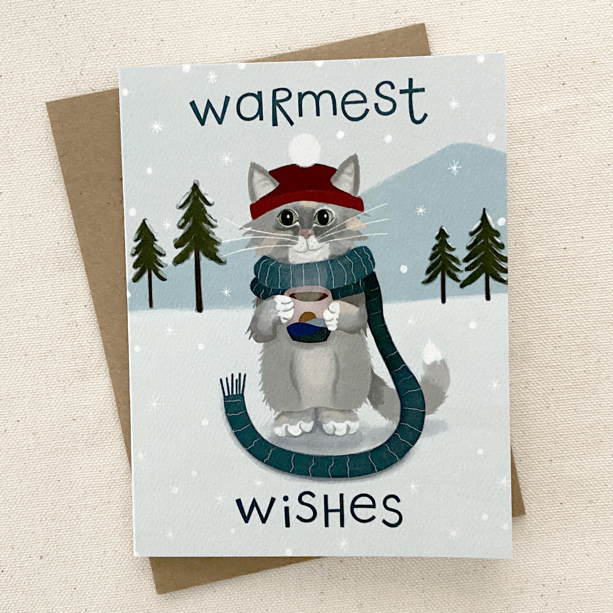Winter cat greeting card on a cream background