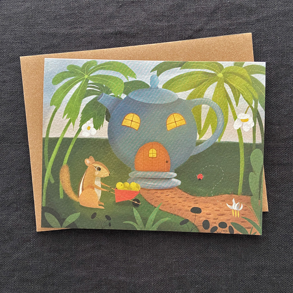 Greeting card with a teapot house and chipmunk illustration on a dark textured background
