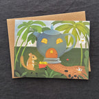 Greeting card with a teapot house and chipmunk illustration on a dark textured background