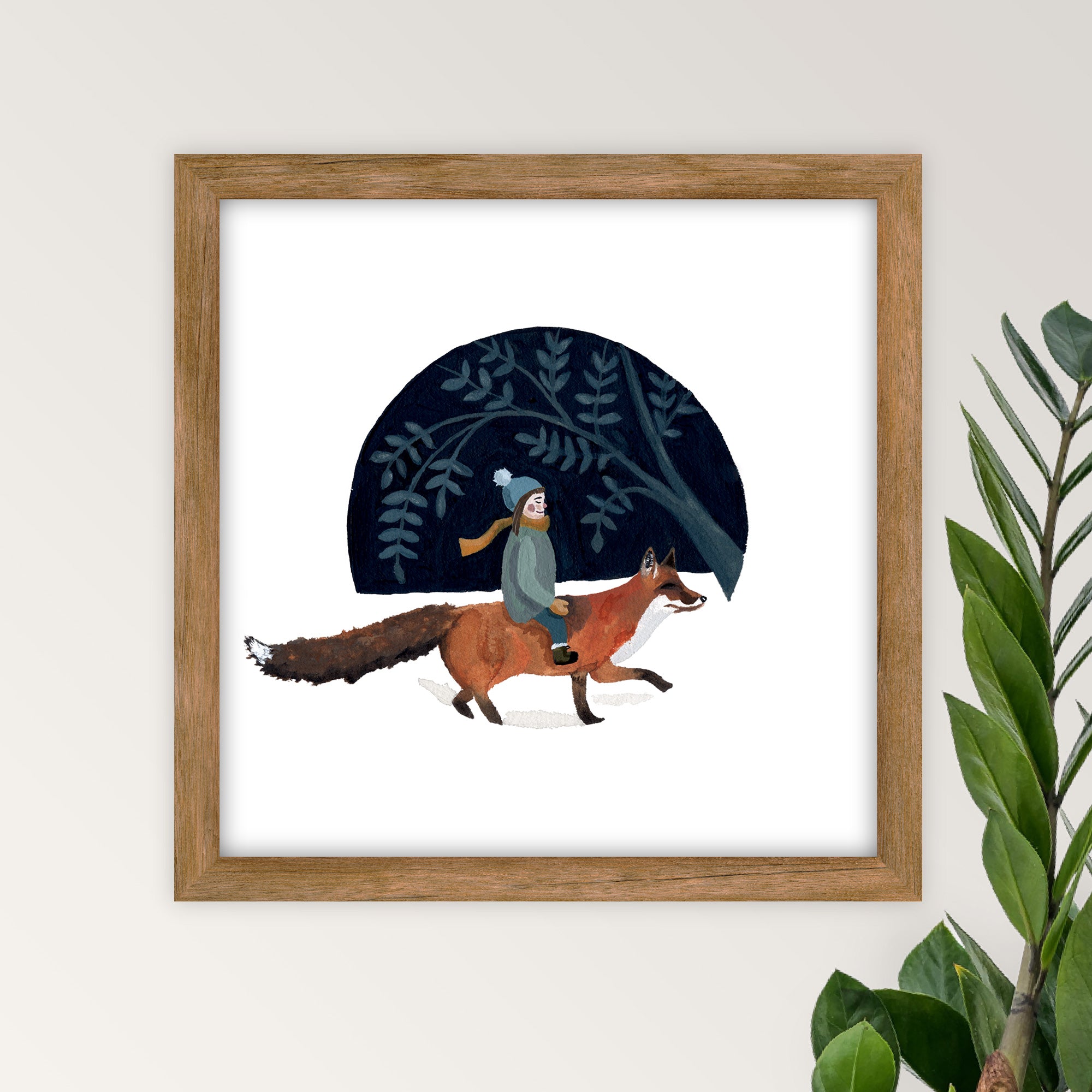 Framed artwork of a young girl riding a fox in a forest setting on a white wall.