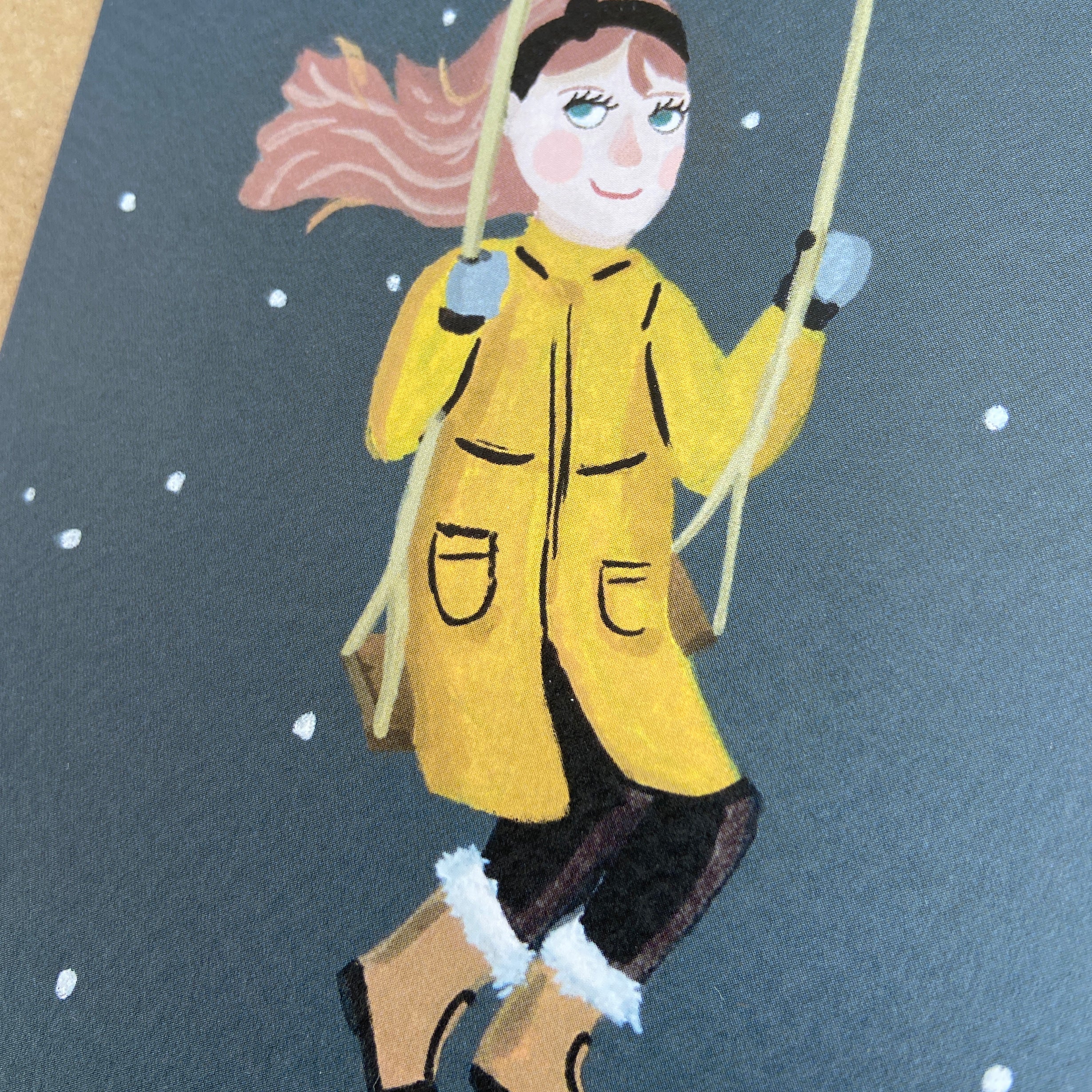 Illustration of a young girl in a yellow coat with boots, swinging on a snowy background.