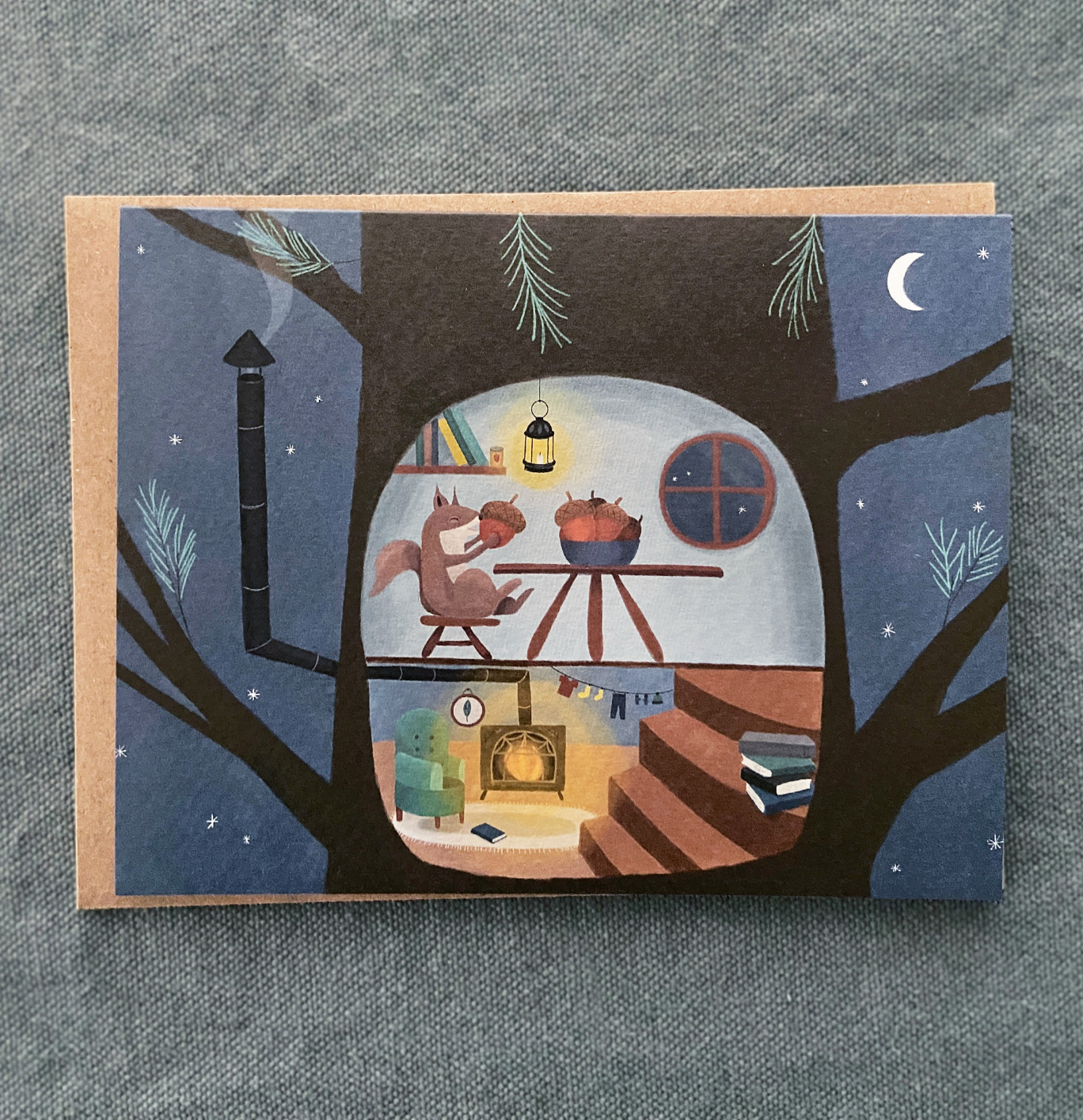 Illustrated card with a squirrel inside a treehouse at night.