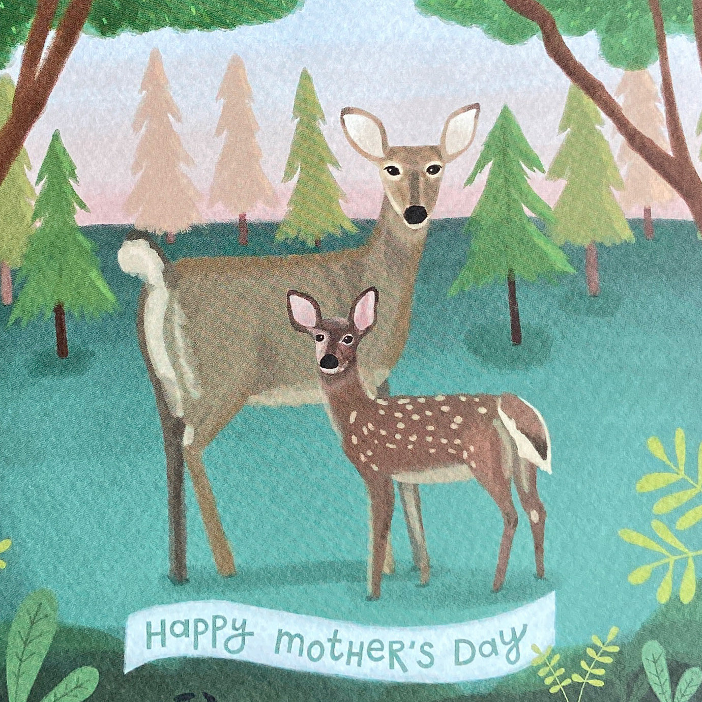 Up close Mother's Day card illustration of two deer in a forest with 'Happy Mother's Day' text.