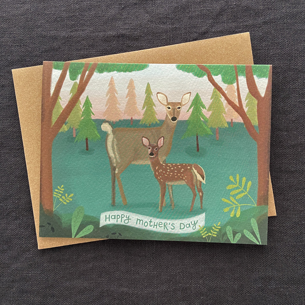 Greeting card with deer illustration and 'Happy Mother's Day' text on a dark fabric background