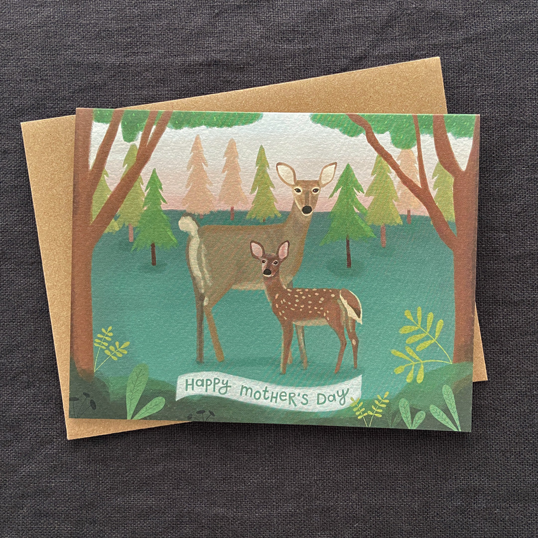 Greeting card with deer illustration and 'Happy Mother's Day' text on a dark fabric background