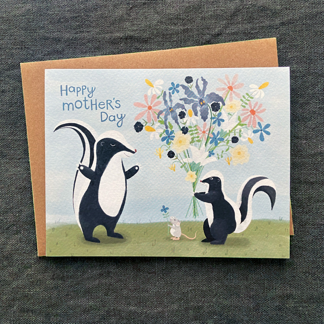 Greeting card with skunks holding flowers and a mouse, on a dark textured background