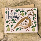 Greeting card with a partridge in a pear tree illustration and 'Happy Holidays' text on a wooden background