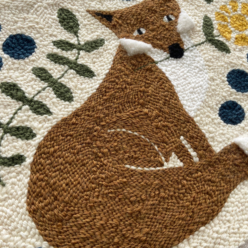 Textured wall art with a brown fox design on a modern floral background