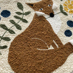 Textured wall art with a brown fox design on a modern floral background