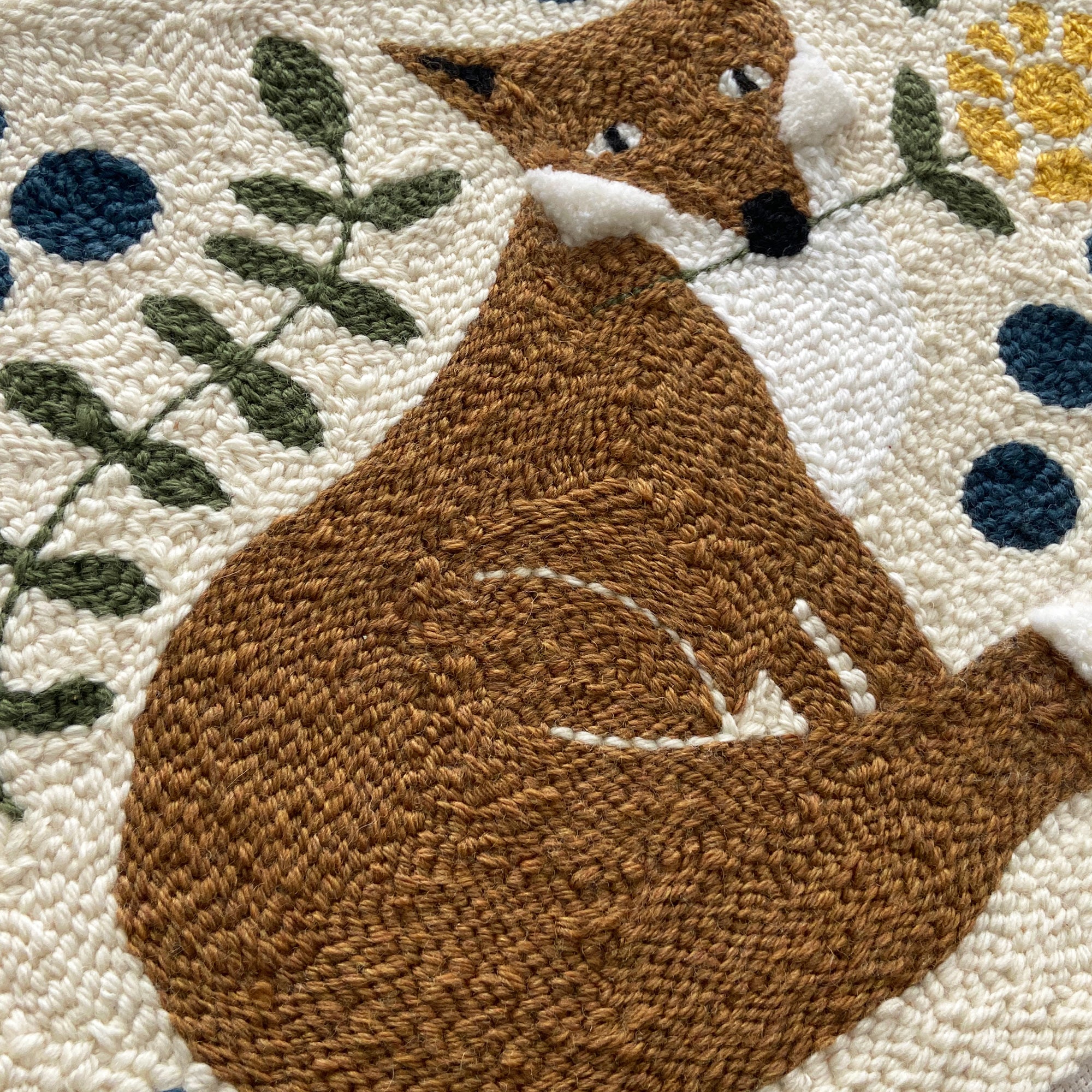 Textured wall art with a brown fox design on a modern floral background