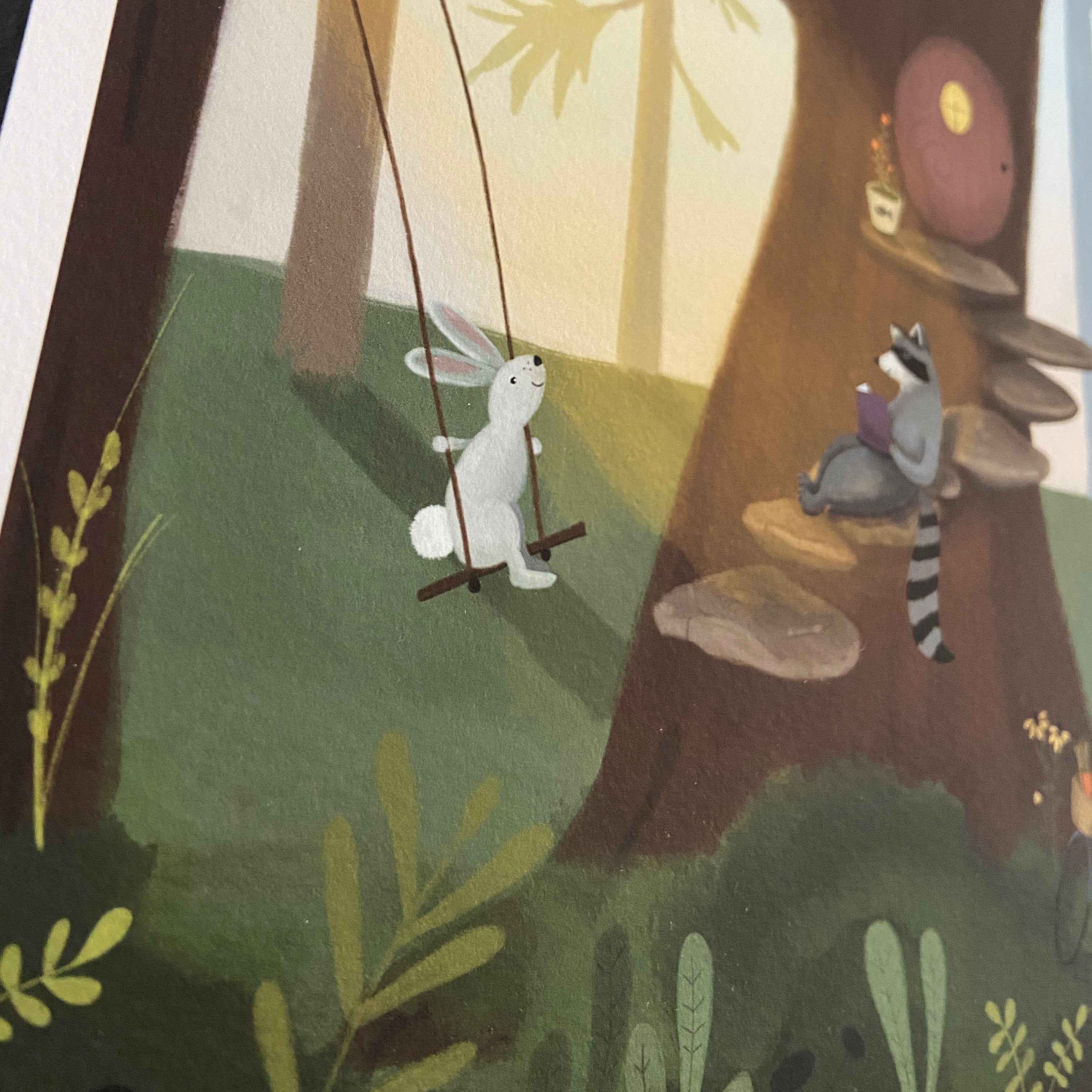 Closeup illustration of a rabbit on a swing and a raccoon reading a book in a forest setting.