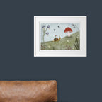 Framed illustration of a snail on a mushroom with flowers and birds against a dark blue wall.