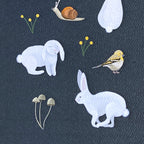 Illustrations of rabbits, a bird, a snail, and plants on a textured dark background.