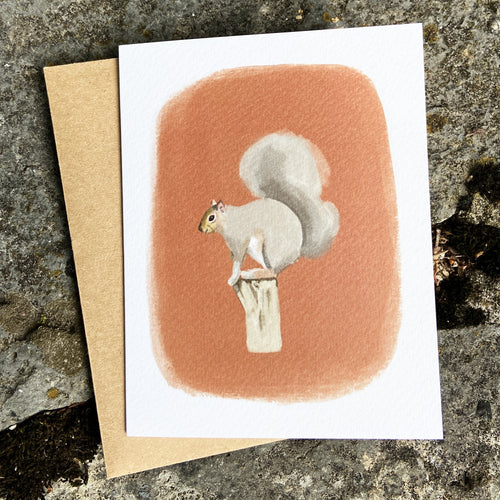 Greeting card with a squirrel illustration on a textured surface